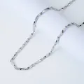 Polished silver Mobius stainless steel twist chain necklace for men shown on white pedestal - Steel Color Mobius