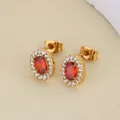 Close-up of golden earrings with red oval zircon and white stone halo accents - Red Simple Oval Style (E0004) / Gold