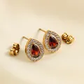 Macro view of water drop earrings with red zircon and 18K gold-plated stainless steel - Red Water Drop Style (E0006) / Gold