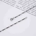 Macro shot of silver titanium steel diamond bar chain bracelet with lobster clasp - 2mm / 19cm / Steel