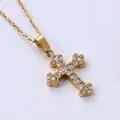 Macro view of gold-plated cross pendant necklace with sparkling micro-pave cubic zirconia - Rounded Petal Cross (N0100) / Gold