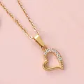 Macro shot of 18K gold plated heart necklace featuring half-pave sparkling zircon inlay - 8-Stone Asymmetric Hollow Style (N0111) / Gold