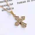 Detailed view of a gold cross pendant necklace featuring pavé set cubic zirconia accents - Vintage Pattern Cross (N0035)