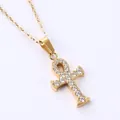 Macro detail of gold Ankh cross pendant set with sparkling cubic zirconia on a link chain - Ankh Cross (N0032) / Gold
