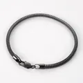 Detailed macro view of gunmetal flat snake chain bracelet with classic lobster clasp - 19cm / Black