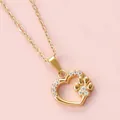 Detailed macro view of 18K gold-plated heart pendant with zircon-studded paw print detail - Heart Paw Print Style (N0114)