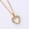 Macro shot of 18K gold heart pendant with micro-pave cubic zirconia on a delicate chain - Uniform Inlaid Heart Style (N0110)