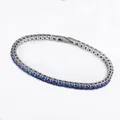 Macro detail of 3mm blue zircon tennis bracelet with S.STEEL hallmark engraving - Tennis Bracelet (B0181C) / 3mm x 180mm / Steel Color (Blue Zirconia)