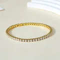 Detail of classic 3mm tennis bracelet with gold finish and cubic zirconia inlay - Gold (White Rhinestone)
