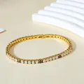 Macro view of gold tennis bracelet with alternating black and white zircon stones - Gold Color (White & Black Zirconia)