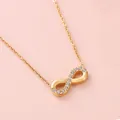 Infinity pendant necklace in gold finish with micro-set zircons on a delicate chain - 11 Stones Style (N0074) / Gold