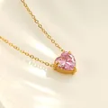 Macro shot of pink heart-shaped zircon pendant with a gold chain on a ceramic tray - 18K Gold (Pink Cubic Zirconia) (N0124G-3)
