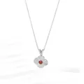 Detail of silver clover pendant with red gemstone and textured floral pattern petals - Clover Silver