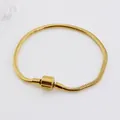 Elegant 18K gold plated snake chain bracelet with shell shaped clasp on white background - Gold Cylinder Clasp