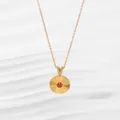 Detail of 18K gold-plated sunburst pendant necklace with a central red stone and zircon V-clasp - Round Style (N0378G) / Round Gold