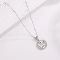 Macro shot of silver zodiac goat pendant necklace with sparkling zirconia and 333 engraving - Zodiac Sheep / Silver