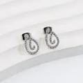 Macro detail of silver teardrop stud earrings with hollow design and pave white cubic zirconia - Water Drop Swirl Style (E0202S) / Silver