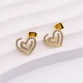 Detail shot of heart-shaped gold stud earrings with cubic zirconia on white pedestal - Heart Swirl Style (E0206G)