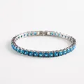 Close-up of silver-tone tennis bracelet with square-cut sky blue cubic zirconia gems - Dark Blue