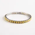 Close-up of square cut yellow cubic zirconia tennis bracelet with silver clasp - Yellow