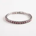Macro shot of silver tennis bracelet featuring square-cut pink zircons and hidden clasp - Light Purple