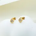 Detailed view of golden teardrop stud earrings with pavé set white zircon stones - Teardrop Gold