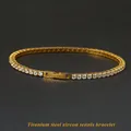 Close-up of titanium steel tennis bracelet with sparkling cubic zirconia and secure box clasp - 18cm / Gold Width 2.5