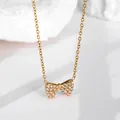 Elegante goldene Schleifenkette mit glänzenden Mikrokristallen für Damen, hochwertig - Gold Vollstrass Stil (N0059)