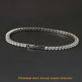Titanium steel tennis bracelet with sparkling round zircons and fold-over clasp - 18cm / Silver Width 2.5