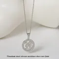 Zilveren titanium stalen ketting met jongen en meisje hanger in een cirkel zirkonia - Zilver Figuren (N0418S)