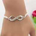 Pulsera infinito plateada con cristales y malla tejida mostrada en la muñeca real - Pulsera Infinito Strass Malla Plata (5780301)