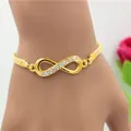 Pulsera de infinito dorada con cristales brillantes y cadena tejida para mujer - Pulsera Infinito Strass Malla Oro (5780302)