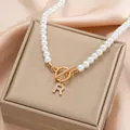 Pearl necklace with golden OT buckle and crystal-encrusted letter R pendant - Gold R