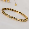 Close-up of gold titanium bracelet featuring black zircon stones and secure folding clasp - Round Inlaid Beaded Style (B0185G-1) / 18cm / Gold / Black Zirconia