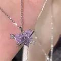 Detail of hand holding a purple heart crystal necklace with planet ring and cupid arrow - Purple Heart Planet Silver Style (5817903)