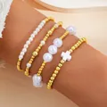Elegante conjunto de cuatro pulseras con perlas artificiales, cuentas doradas y cruz - Estilo colgante cruz perla artificial / Set de 4 piezas / Dorado