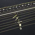 Elf-teiliges goldenes Halsketten-Set mit Stern Schmetterling und Kreuz Anhängern - Goldene Mehrlagige Perlenanhänger Halsketten Kollektion (6351501HB) / Gold