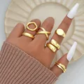 Set of 6 minimalist gold wave and cross rings worn on hand for a stackable jewelry look - Gold Modern Minimalist Wave Geometric Style (6254301HB)