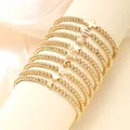 Set de 9 pulseras de cuentas doradas con dijes de cruz concha y estrella en seda - Estilo Con Múltiples Dijes / Juego De 9 / Dorado