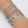 Macro detail of silver layered bracelet set with infinity charms and rhinestone links - Silver