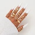 Close-up of 25-piece gold butterfly and heart stacking rings worn on model fingers - Gold Butterfly Heart Snake Artificial Pearl Style (6476301) / Gold