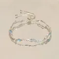 Pulsera elástica estrella arcoíris con dijes de esmalte azul claro y cuentas de plata - Pulseras de olas azules