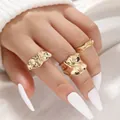 Macro detail of three-piece gold ring set with irregular hammered lava texture on hand - Irregular Hammered 3-Piece Set (6226001) / Gold