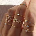 Bohemian gold ring set with star, moon, and heart designs featuring 9 unique pieces - Gold Heart Love Olive Leaf Rhinestone Ring 7-Piece Set (5932401) / Gold