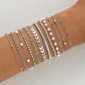 Close-up of a 10-piece silver bracelet set with pearls and rhinestones on a wrist - Airplane Chain Pearl 12-Piece Set / Silver