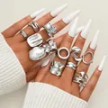 12-piece silver irregular geometric ring set with pearls on a female model hand - Multi-Piece Irregular Liquid Metal Artificial Pearl Rhinestone Ring Set (6475102HB)