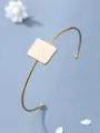 Bracciale rigido dorato con quadrato in smalto crema e rilievo a stella - Bianco