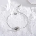 Bracciale in acciaio al titanio argento lucido con numeri romani e pavé di zirconi - Bracciale / Colore acciaio
