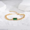 Elegante bracciale in oro e acciaio con gemma verde smeraldo e catena asimmetrica - Bracciale Oro