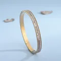 Dettagli del bracciale placcato in oro rosa con cristalli bianchi e inserto in madreperla - Oro